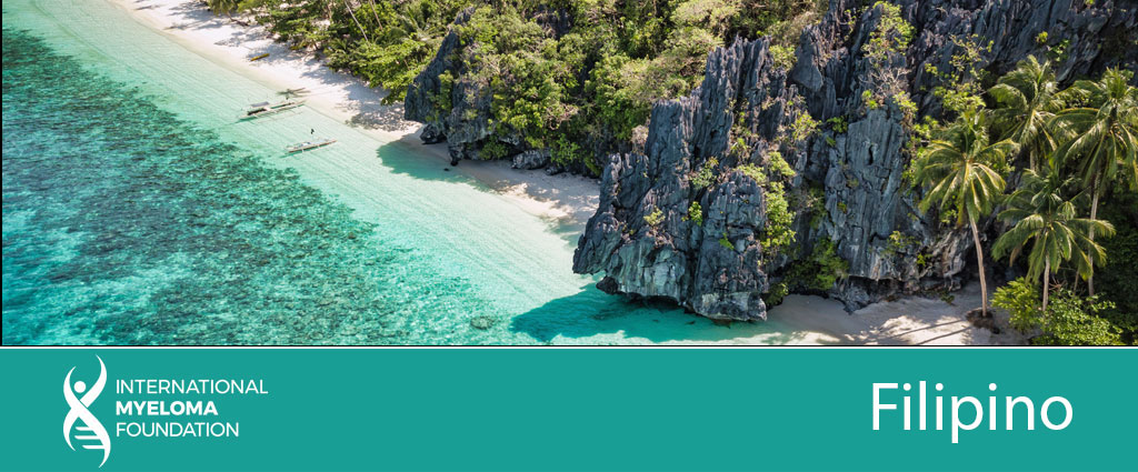 Beach with bangkas, cococnut trees, rock formations, and clear blue waters